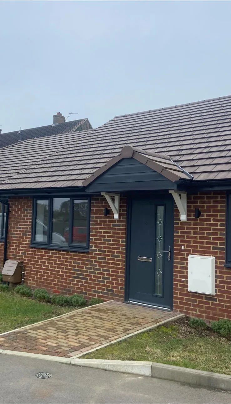 Completed bungalow with new tiled roof and gable porch