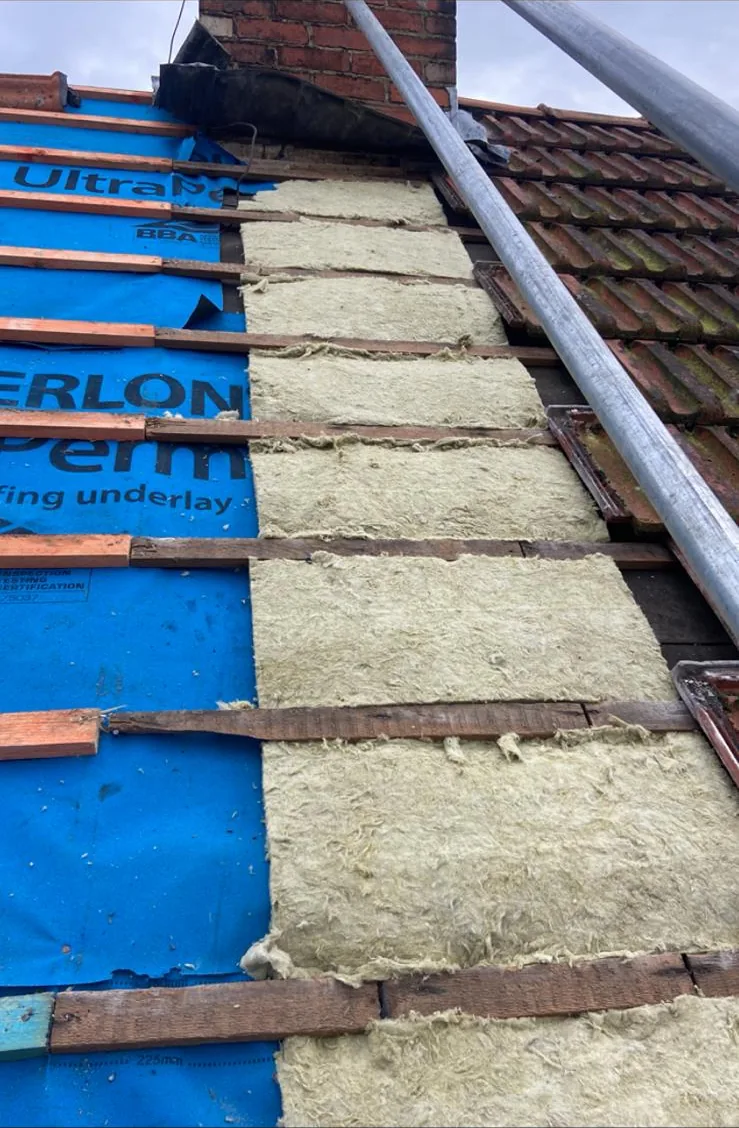 Breathable roofing membrane and battens with insulation between rafters